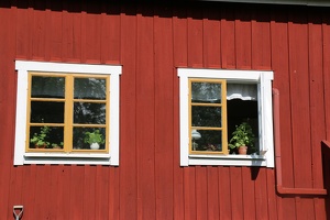 Windows on red house